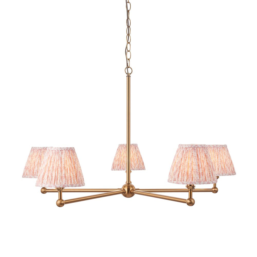 Cliffleigh Leaf 5-Light Pendant featuring a brushed brass frame, pleated pink leaf-print fabric shades on splayed arms, and a chain suspension.
