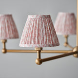 Cliffleigh Leaf 5-Light Pendant with pleated pink floral fabric shades on brushed brass arms and ball joint fittings, shown against a grey background.