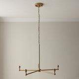 Cliffleigh Leaf 5 Light Pendant with brass chandelier frame, five candle-style arms, chain suspension, ceiling rose, plain light background.