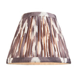 Cliffleigh Ikat pendant shade in grey and cream Ikat-print pleated fabric with brass trim, shown close-up on a white background.