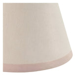 Close-up of the Cliffleigh Ivy Wall Light's tapered vintage white fabric shade with almond taped edge, shown against a plain background.