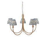 Endon Cliffleigh 5 light pendant with curved brushed brass arms and marlin blue rippled pleated fabric shades, hung from a chain on a white background.