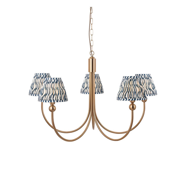 Endon Cliffleigh 5 light pendant with curved brushed brass arms and marlin blue rippled pleated fabric shades, hung from a chain on a white background.