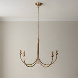 Endon Cliffleigh pendant frame with five curved arms and B22 lampholders in brushed aged brass, shown without shades against a neutral wall.