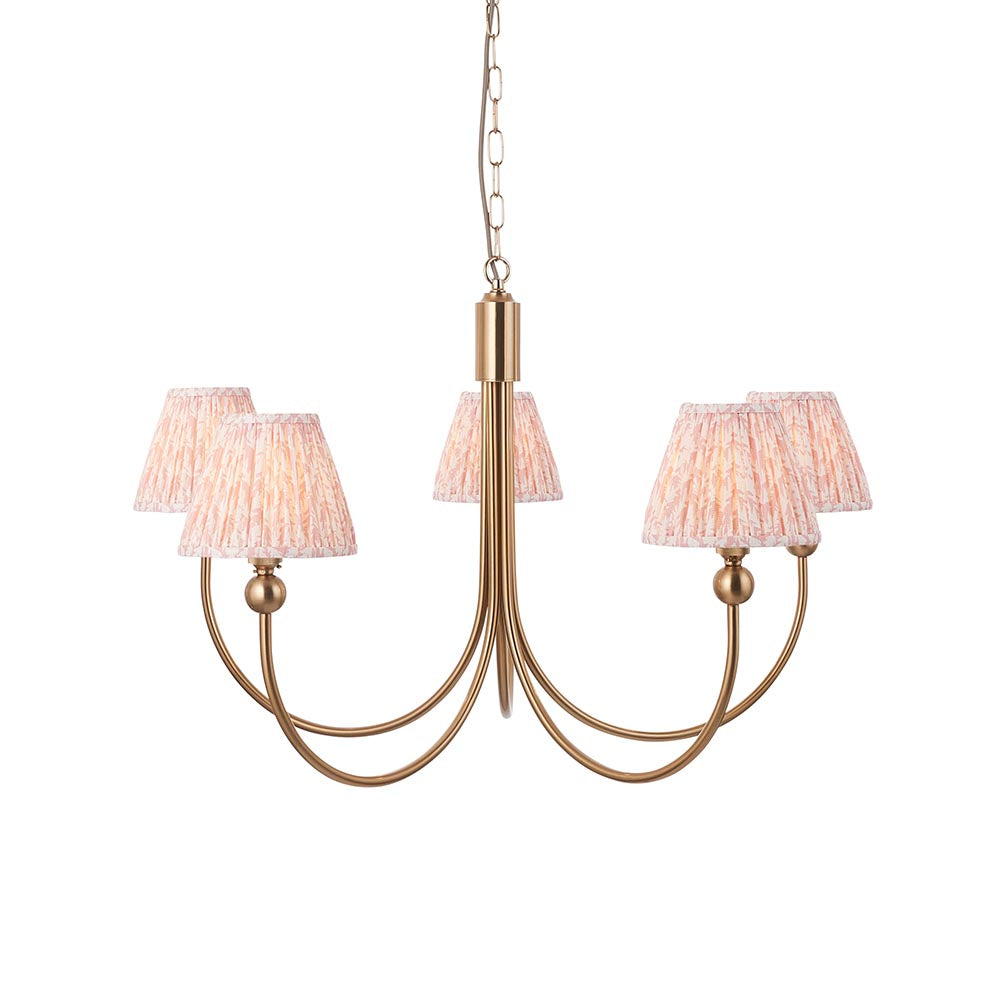 Cliffleigh Leaf 5 Light pendant with curved brass arms and pleated pink-patterned fabric tapered shades, hung on a chain against a plain white background.