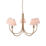 Cliffleigh Leaf 5 Light pendant with curved brass arms and pleated pink-patterned fabric tapered shades, hung on a chain against a plain white background.