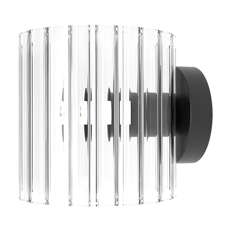 Blur Ribbed Glass Wall Light in matt black, cylindrical clear ribbed glass shade on a round matt black backplate, shown on a plain white background.