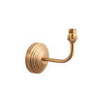 Castgrove Wall Light in brushed aged brass with a stepped circular backplate, curved arm and B22 lampholder, shown on a plain white background.