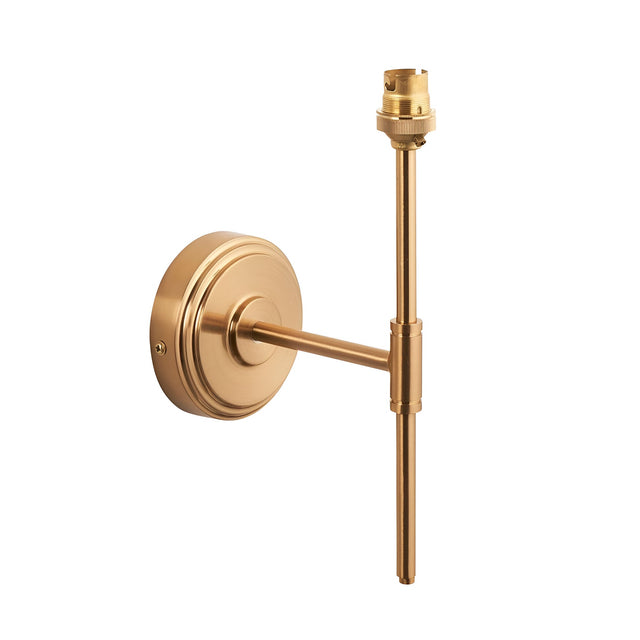 Endon Cliffworth wall light in brushed aged brass, with a stepped round backplate, fixed T-bar arm, and B22 lampholder, shown on a white background.