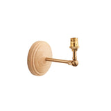 Endon Danemere wall light with round natural ash wood backplate and adjustable brushed aged brass arm ending in a B22 lampholder, on a white background.