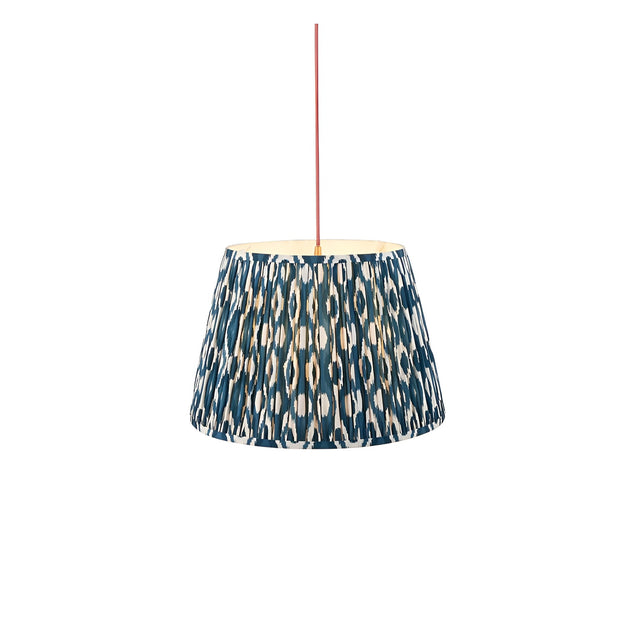 Endon Brackmont Ikat pendant light with a tapered pleated shade in marlin blue faux silk ikat print, suspended from a red fabric cable.