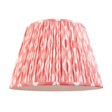 Endon Brackmont pendant shade in handmade pleated coral pink Ikat print faux silk with taped edges, shown on a plain white background.