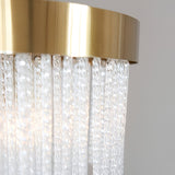 Close-up of Endon Aldfield 5 Light Pendant showing brushed brass frame and textured clear glass rods hanging in a tiered arrangement.