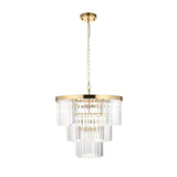 Endon Bevstead 7 light pendant in brushed brass with tiered clear cut glass lozenge drops, suspended from a chain on a white background.