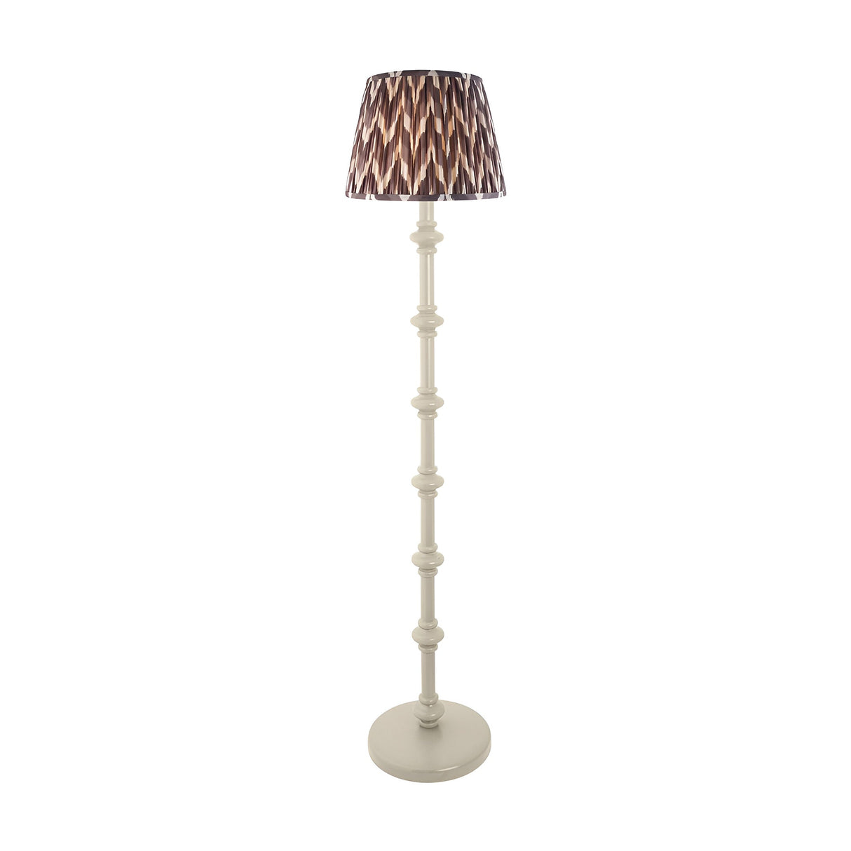 Endon Bevbury floor lamp with turned white spindle base and grey zigzag patterned pleated fabric shade on a plain background.