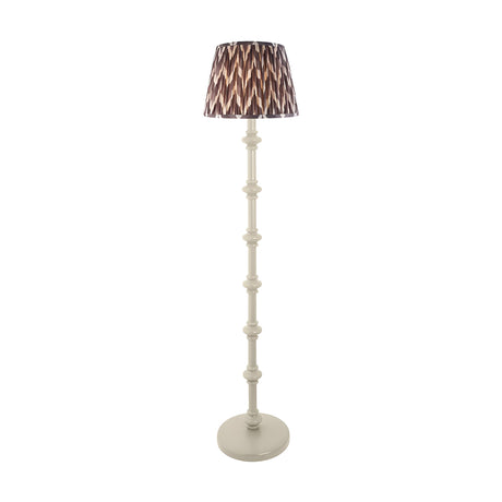 Endon Bevbury floor lamp with turned white spindle base and grey zigzag patterned pleated fabric shade on a plain background.