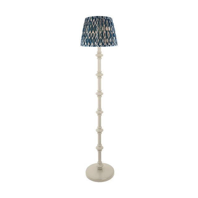 Endon Bevbury floor lamp with white turned spindle wood base and blue Ikat pleated fabric shade, shown on a plain white background.