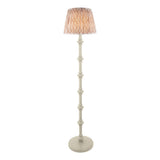 Bevbury Ikat Floor Lamp with turned wooden spindle base in white and a pleated Ikat fabric shade in grey and natural tones, shown on a plain background.