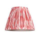 Endon Brackdale Ikat wall light shade in pleated coral pink and white ikat print faux silk, shown on a plain white background.