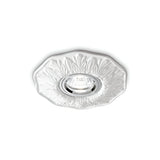 The Olivia Recessed Downlight - White features an ornate floral design that seamlessly complements modern interiors. Its intricate pattern adds an elegant touch, enhancing the minimalist lighting of the space.
