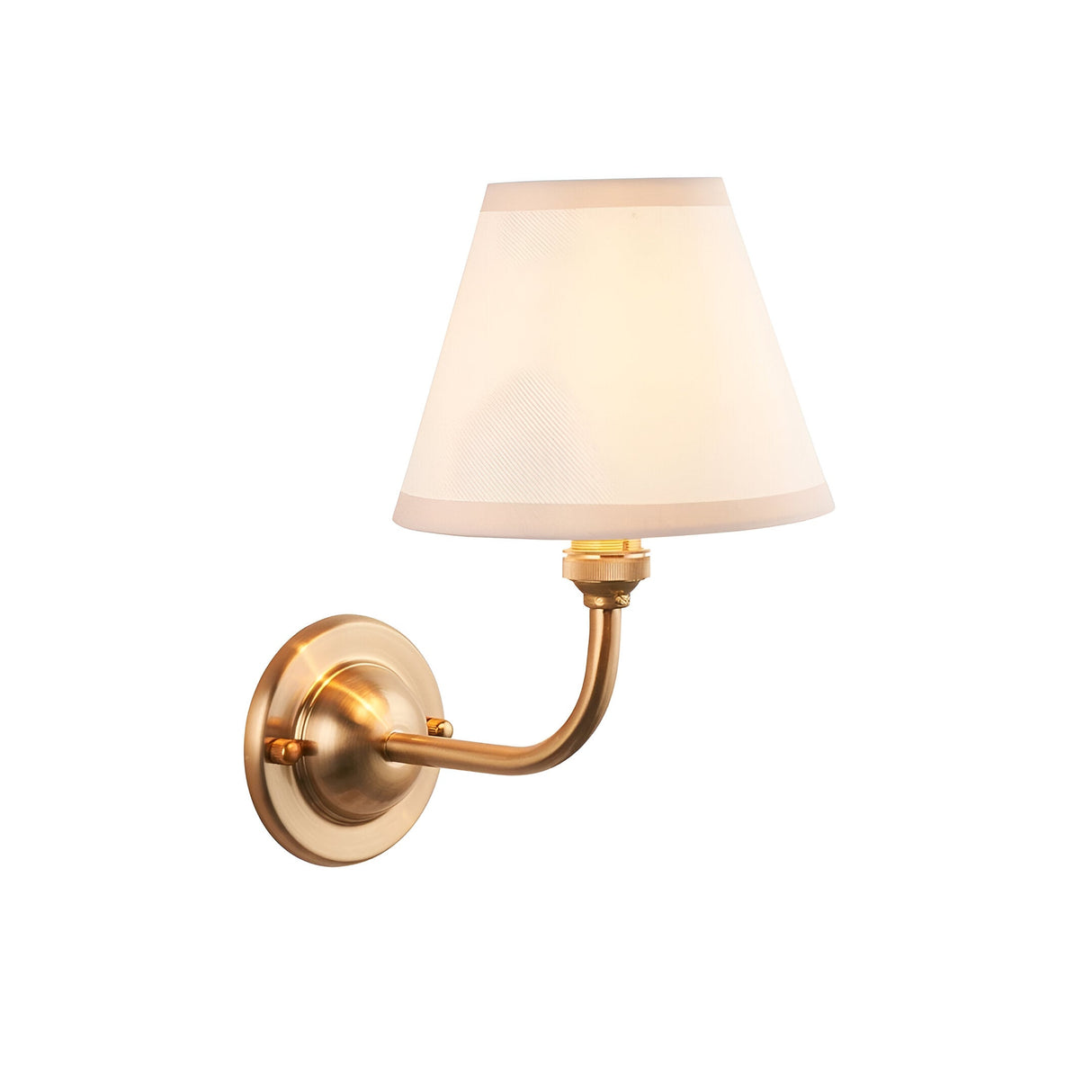 Brackdale Ivy Wall Light with a curved brushed antique brass arm and tapered vintage white fabric shade, single B22 fitting on a plain white background.