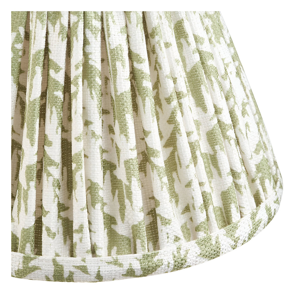 Close-up of the Cliffwood Leaf Wall Light's pleated fabric shade, showing green leaf pattern on cream linen with taped edge trim.