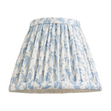 Endon Cliffwood Leaf pleated wall light shade in blue and white faux linen with botanical leaf print, shown on a plain white background.