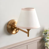 Endon Cliffwood Ivy wall light in brushed aged brass with an adjustable arm and tapered vintage white fabric shade with almond taped edge.