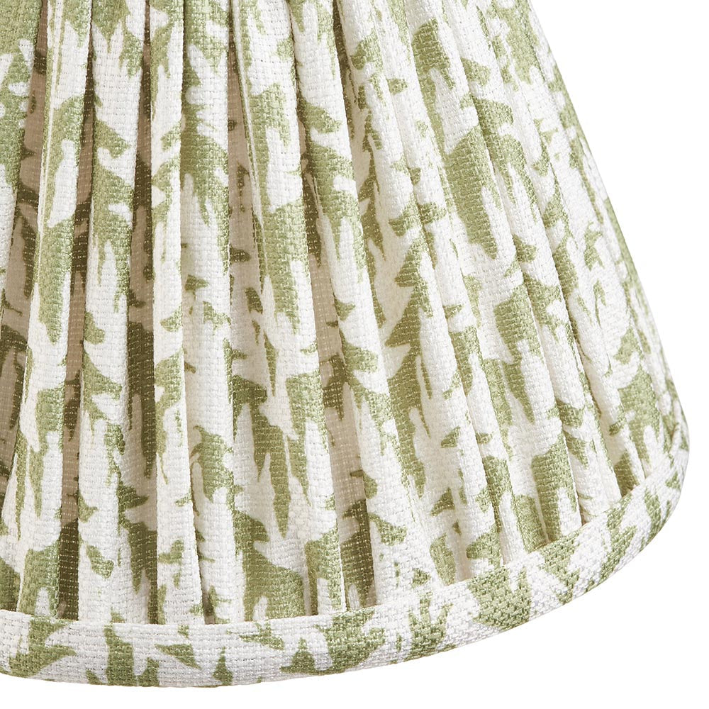 Close-up of the Endon Danemere wall light's pleated faux linen shade, printed with a herb green leaf pattern and finished with taped edge detail.