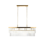 Bevstead 4 Light Linear Pendant in brushed brass with clear crystal glass drops on a rectangular bar, suspended by twin chains against a plain white background.