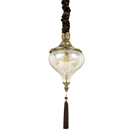 The Daley 1 Light Glass Pendant - Brass is a vintage-inspired lighting fixture featuring an ornate gold decorative top and a clear handcrafted glass lampshade. It is elegantly designed with a long brown tassel, sophisticated brown cord covering, and subtle brass accents to enhance its classy appearance.