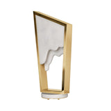 The Atria LED Alabaster Table Lamp – Brushed Brass showcases a modern sculptural design with a brass frame and white Spanish alabaster-like interior, creating a unique melting effect on an elegant round base.