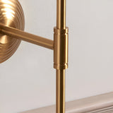 Close-up of the Castleigh Leaf Wall Light's brushed brass T-shaped arm and jointed connector against a plain light background.