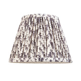 Castleigh Leaf Wall Light shade in grey, tapered pleated fabric with abstract leaf print and taped edging, shown on a plain white background.