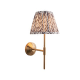 Castleigh Leaf Wall Light in Grey with antique brass stepped back plate, T-shaped arm, and pleated leaf-print fabric tapered shade, on white background.