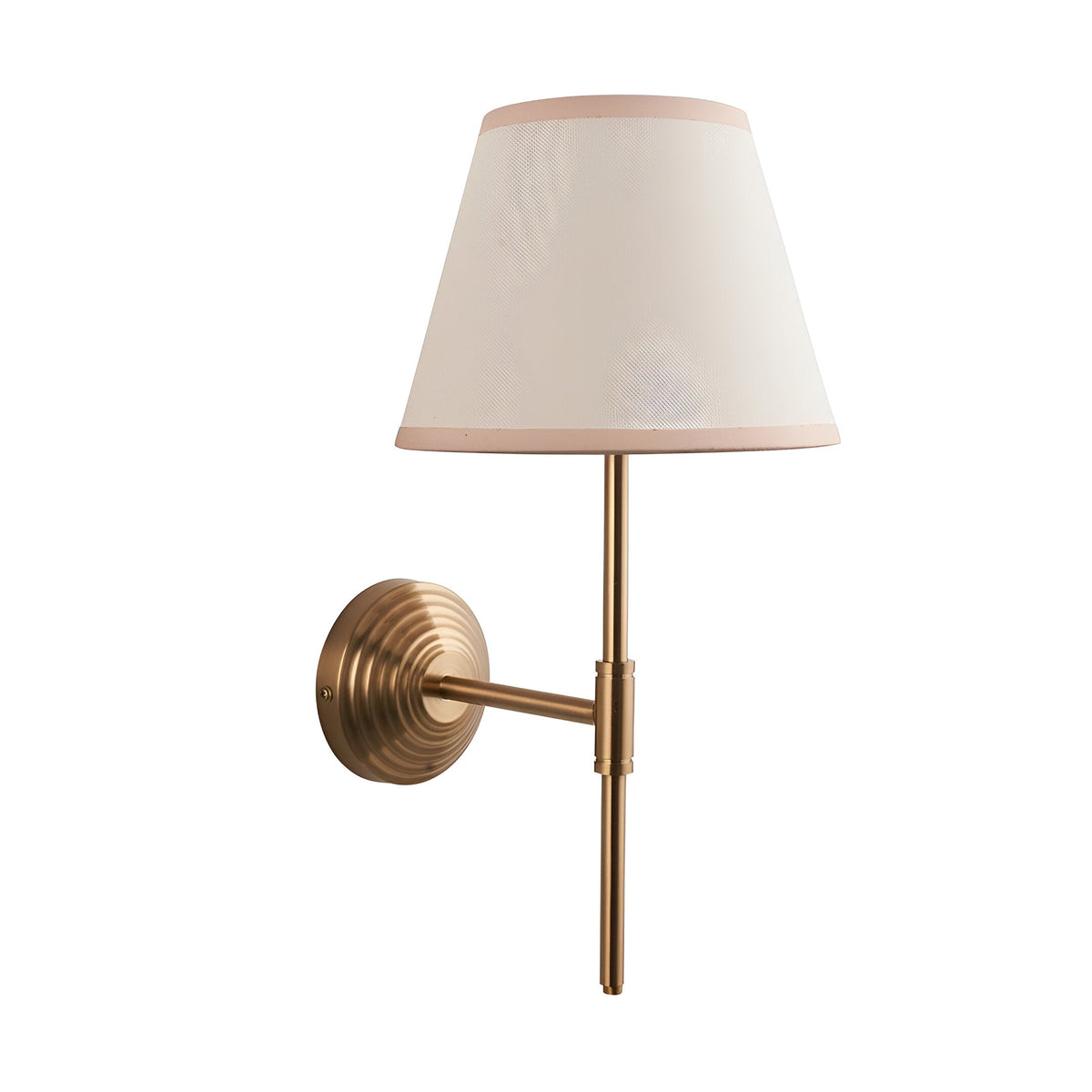 Castleigh Ivy wall light in brushed brass with stepped back plate, adjustable T-shaped arm, and tapered vintage white fabric shade with almond trim.