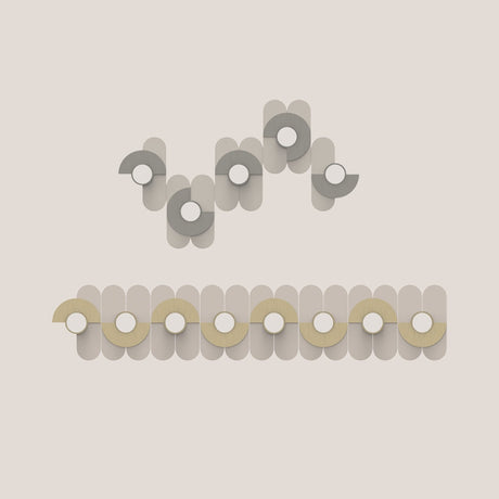 Brera Linea Glass Wall Light in brushed pale gold shown twice: as a curved multi-unit arrangement and a linear row, each with iron arcs and round glass diffusers on a light background.