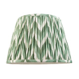 Pleated Zigzag lamp shade in green and white chevron faux silk, shown alone on a plain white background.