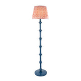 Endon Bevbury Ripple floor lamp with a blue turned wood spindle base and a pink and coral rippled pleated faux linen shade on a white background.