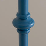 Close-up of the Endon Bevbury Ripple floor lamp's turned wooden spindle base in marlin blue satin paint, showing shaped rings against a light grey background.