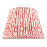 Endon Bevbury Ripple 35cm gathered pleat lampshade in pink and white wave-patterned faux linen with taped edging, shown on a plain white background.