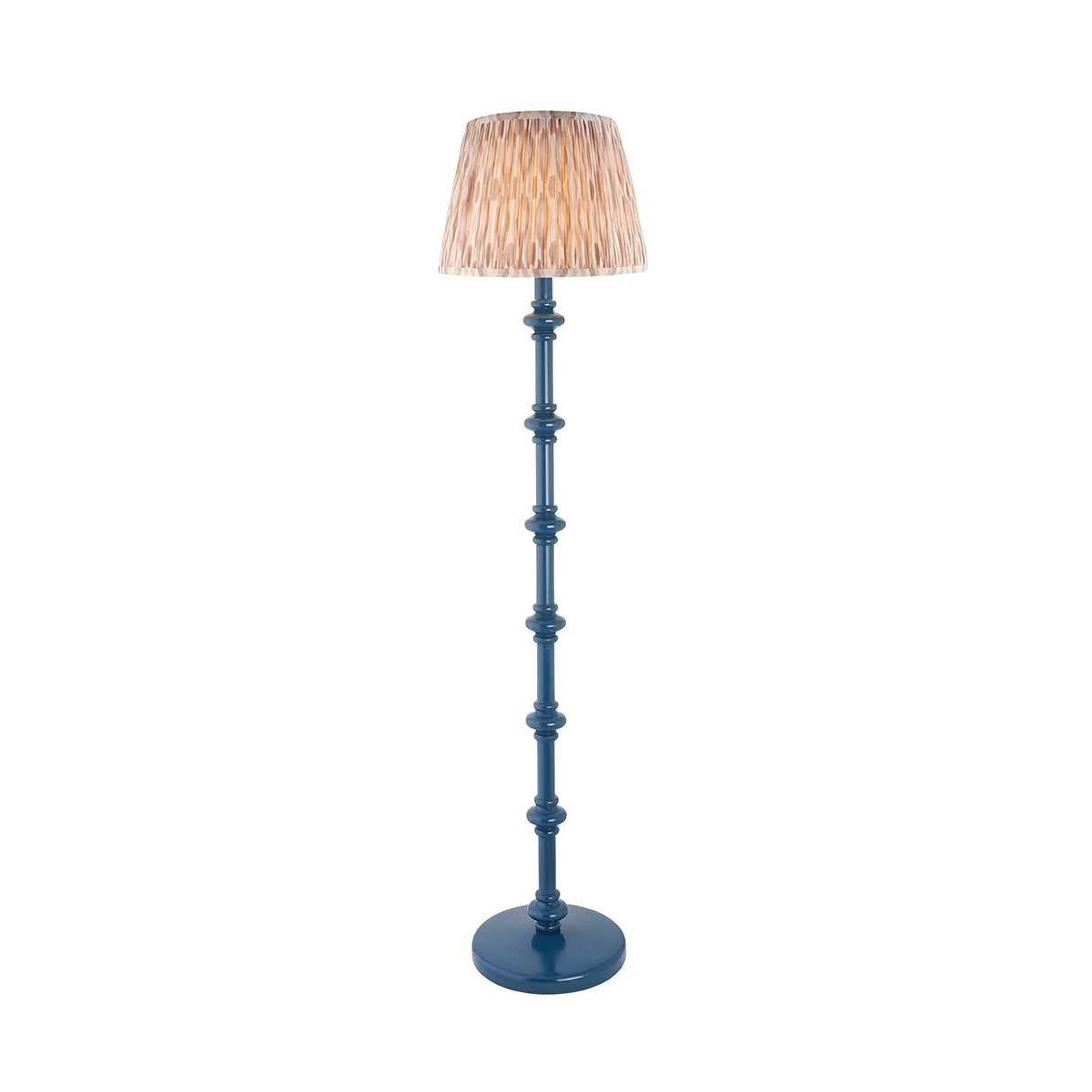 Endon Bevbury Ikat floor lamp with blue turned wood spindle base and pleated natural patterned faux silk shade on a plain white background.