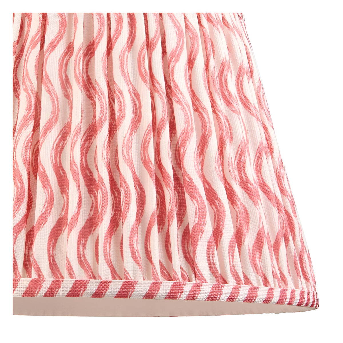 Close-up of the Endon Bevbury Ripple floor lamp shade, a pleated faux linen design with pink wavy pattern and striped taped edge.
