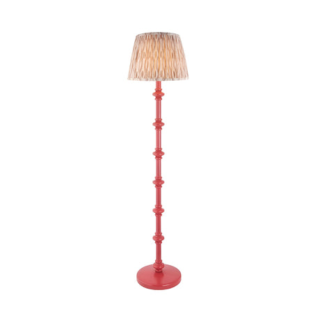 Endon Bevbury Ikat floor lamp with a pink turned wooden spindle base and patterned natural faux silk pleated shade, shown on a plain white background.