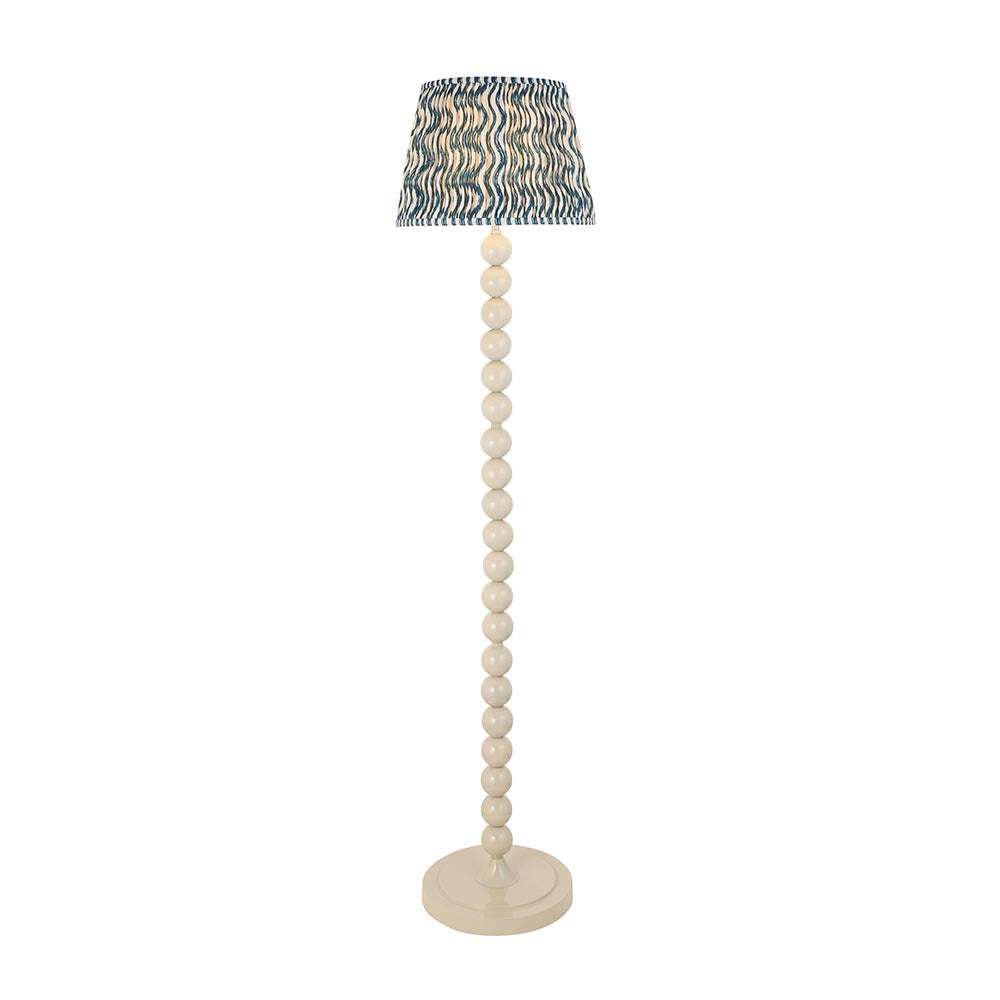 Endon Brenleigh Ripple floor lamp with a stacked white sphere base and a blue and white rippled faux linen tapered shade on a plain background.