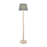 Endon Brenleigh Ripple floor lamp with a stacked white sphere base and a blue and white rippled faux linen tapered shade on a plain background.