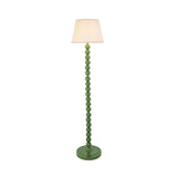 Endon Brenleigh Ivy floor lamp with glossy Cotswold green stacked sphere base and tapered vintage white Ivy fabric shade on a plain background.