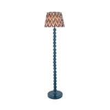 Brenleigh Zigzag Floor Lamp with blue stacked-sphere base and round pleated grey zigzag-pattern fabric shade, shown on a plain white background.
