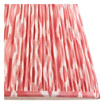 Close-up of the Endon Brenleigh floor lamp's pink Ikat shade, a gathered pleat faux silk in coral and white with taped edge detailing.