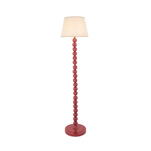 Endon Brenleigh Ivy floor lamp with glossy pink stacked sphere base and tapered vintage white fabric shade on a plain background.